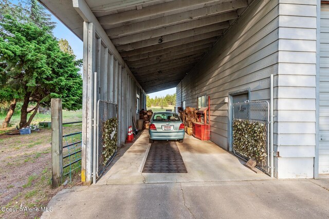 15248 N Atlas Rd, Rathdrum, ID 83858 - view of car parking featuring an attached carport and concrete driveway