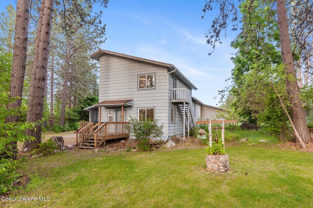 15248 N Atlas Rd, Rathdrum, ID 83858 - rear view of property featuring a yard, a deck, and stairway