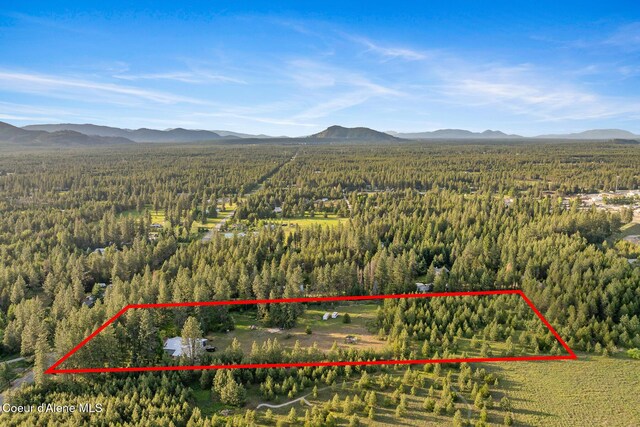 15248 N Atlas Rd, Rathdrum, ID 83858 - view of property location featuring a heavily wooded area, mountains, and property parcel outlined