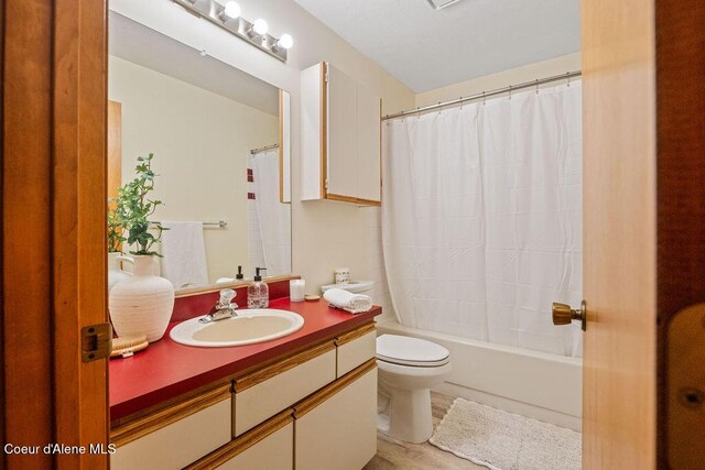 1130 E Timber Ln # 2, Coeur Dalene, ID 83815 - bathroom with vanity, toilet, and shower / bath combination with curtain