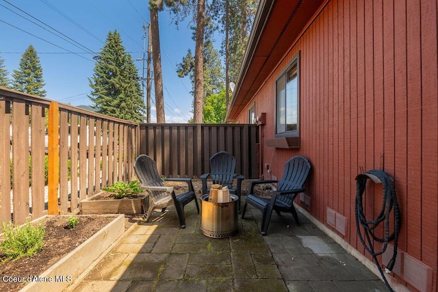 1130 E Timber Ln # 2, Coeur Dalene, ID 83815 - fenced backyard with a patio area and a garden