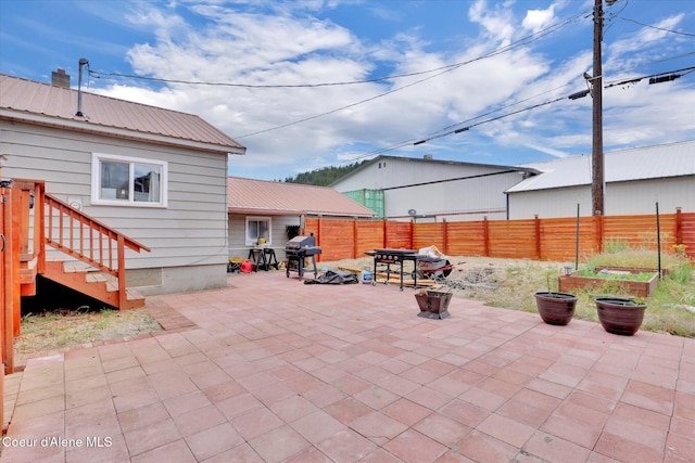 316 W Brown Ave, Kellogg, ID 83837 - fenced backyard with a patio and grilling area