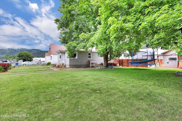 316 W Brown Ave, Kellogg, ID 83837 - view of yard featuring a trampoline and a mountain view
