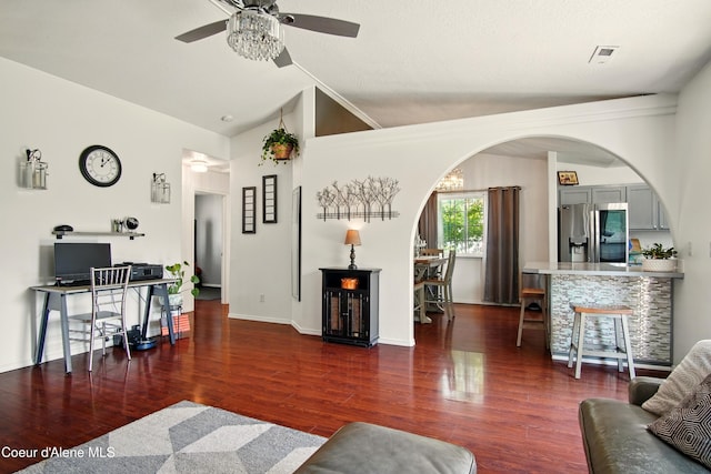 500 N Elm Rd, Post Falls, ID 83854 - living room with a ceiling fan, arched walkways, wood finished floors, lofted ceiling, and baseboards