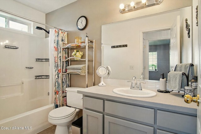 500 N Elm Rd, Post Falls, ID 83854 - bathroom featuring plenty of natural light, toilet, vanity, and shower / bath combo