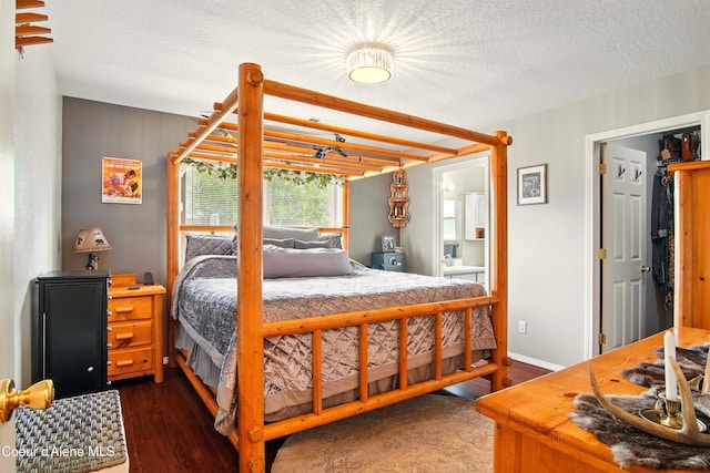 500 N Elm Rd, Post Falls, ID 83854 - bedroom featuring dark wood-style floors and ensuite bath