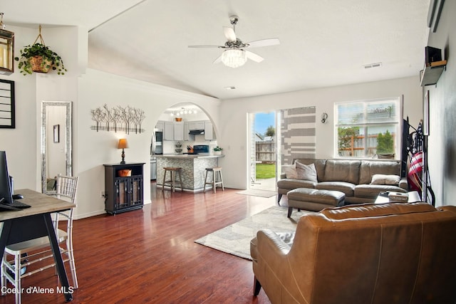 500 N Elm Rd, Post Falls, ID 83854 - living room with dark wood finished floors, a ceiling fan, arched walkways, and baseboards