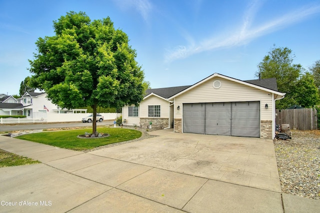 500 N Elm Rd, Post Falls, ID 83854 - ranch-style home featuring a garage, concrete driveway, and brick siding
