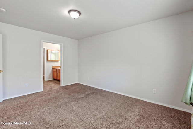 175 E Jeffrey Pine Ln, Coeur Dalene, ID 83815 - unfurnished bedroom with carpet flooring, baseboards, and ensuite bathroom