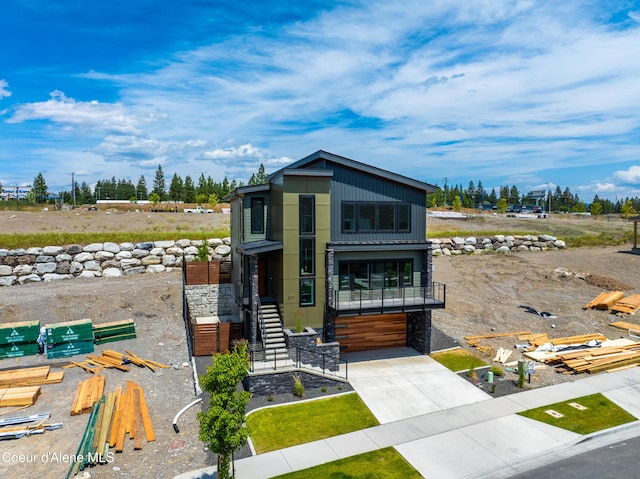 2671 W Lumber Ln, Coeur Dalene, ID 83814 - modern home with concrete driveway and a garage