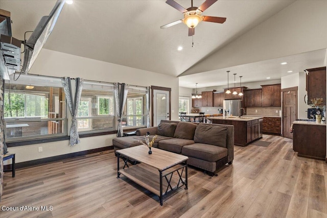 23378 N Prominence Rd, Rathdrum, ID 83858 - living area featuring light wood-style floors, a ceiling fan, healthy amount of natural light, recessed lighting, and a chandelier