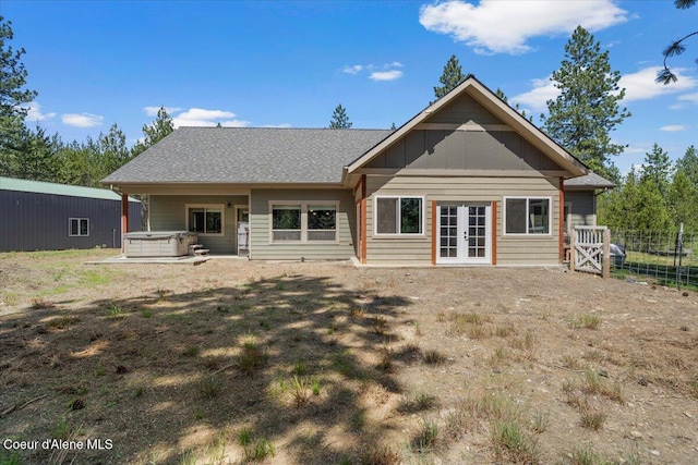 23378 N Prominence Rd, Rathdrum, ID 83858 - back of property featuring a hot tub and french doors