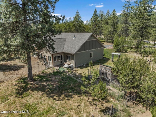 23378 N Prominence Rd, Rathdrum, ID 83858 - rear view of house featuring roof with shingles and board and batten siding
