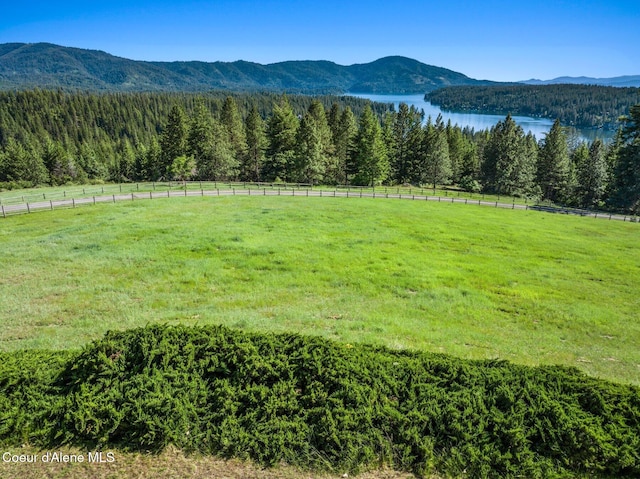 16529 N Triangle 7 Rd, Hayden, ID 83835 - view of mountain backdrop featuring a forest, a large body of water, and rural landscape