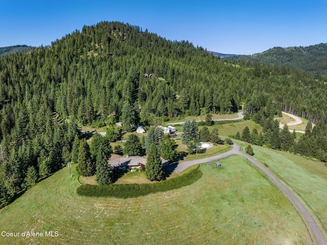 16529 N Triangle 7 Rd, Hayden, ID 83835 - aerial view of property and surrounding area with a heavily wooded area and mountains