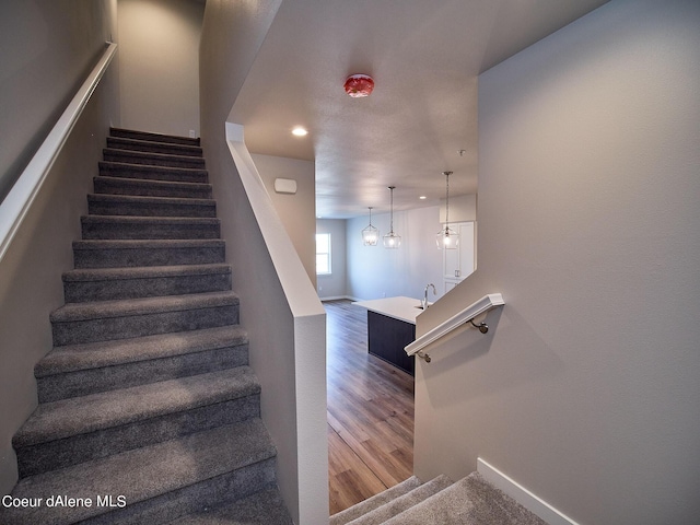 1048 E 4th Ave, Post Falls, ID 83854 - stairs featuring wood finished floors and recessed lighting