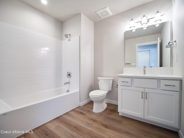 1048 E 4th Ave, Post Falls, ID 83854 - bathroom featuring toilet, shower / bath combination, vanity, and wood finished floors