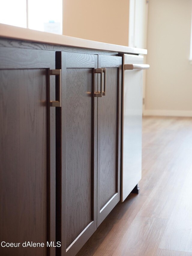 1048 E 4th Ave, Post Falls, ID 83854 - detailed view of wood finished floors and baseboards