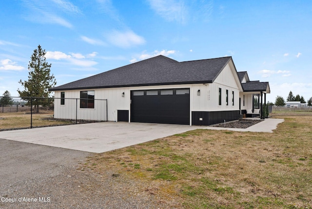 27455 N Caribou Ave, Athol, ID 83801 - view of side of home featuring driveway, an attached garage, and a shingled roof