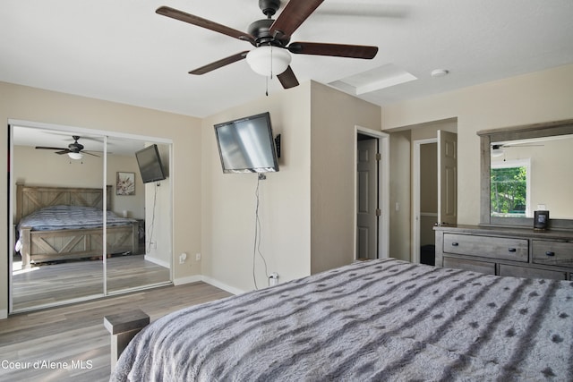 15272 N Stevens St, Rathdrum, ID 83858 - bedroom with wood finished floors, ceiling fan, and baseboards