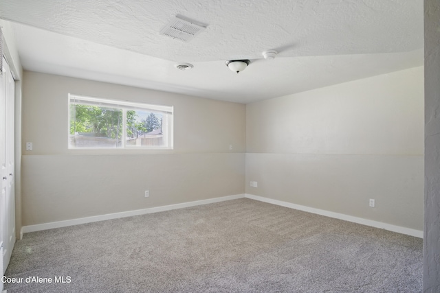 15272 N Stevens St, Rathdrum, ID 83858 - carpeted empty room with a textured ceiling and baseboards
