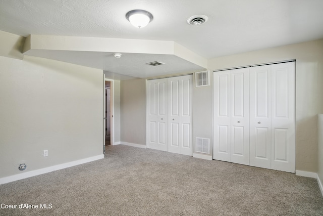 15272 N Stevens St, Rathdrum, ID 83858 - unfurnished bedroom with carpet, multiple closets, and baseboards