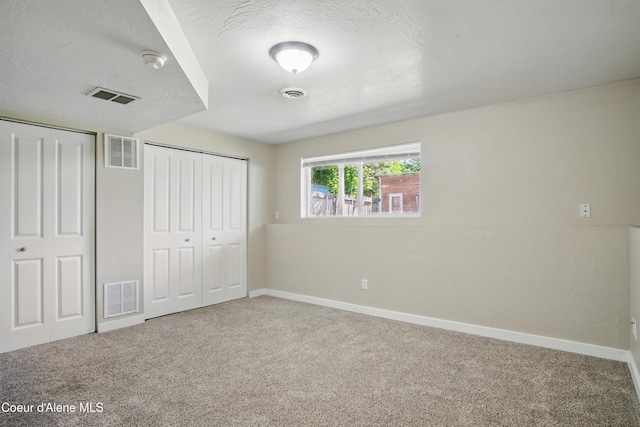 15272 N Stevens St, Rathdrum, ID 83858 - unfurnished bedroom with carpet floors, baseboards, and a textured ceiling