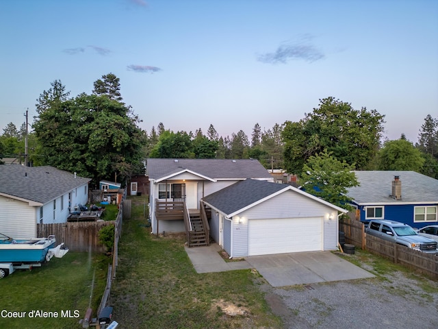15272 N Stevens St, Rathdrum, ID 83858 - ranch-style house featuring a garage, stairway, and a shingled roof