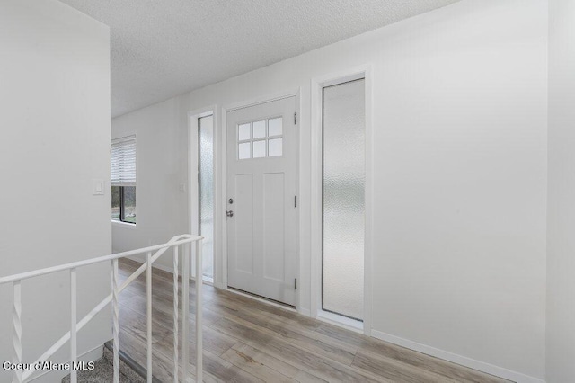 16 Beers Humbird Rd, Sagle, ID 83860 - entryway featuring light wood finished floors and a textured ceiling