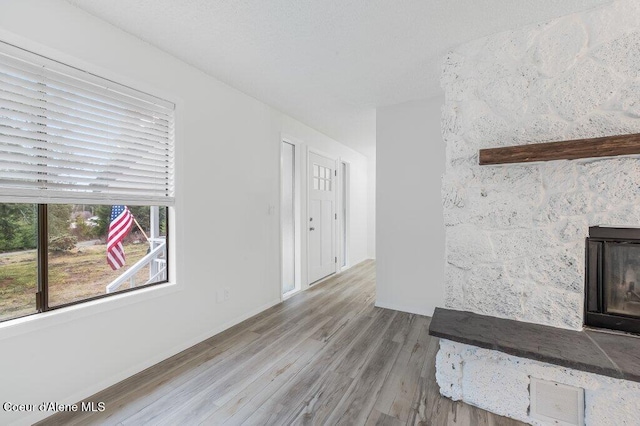 16 Beers Humbird Rd, Sagle, ID 83860 - unfurnished living room featuring wood finished floors and baseboards