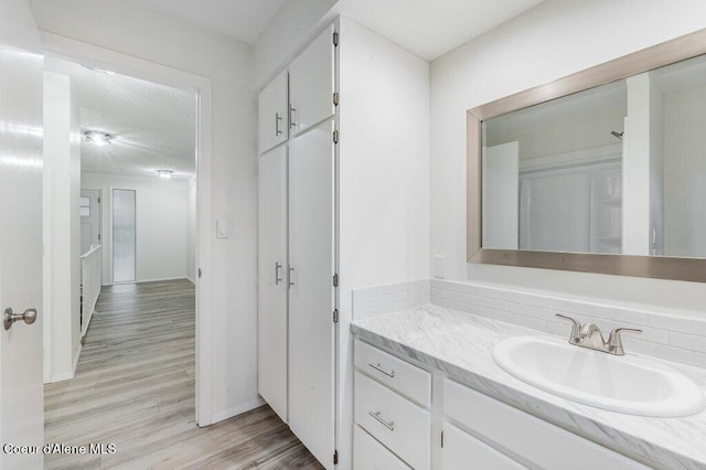 16 Beers Humbird Rd, Sagle, ID 83860 - bathroom featuring vanity and wood finished floors