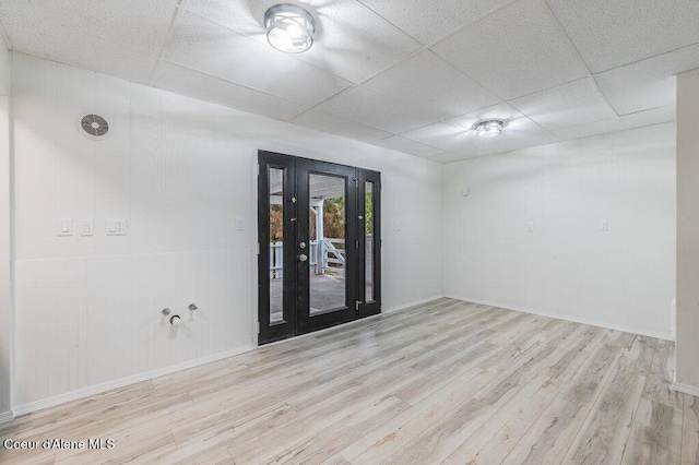 16 Beers Humbird Rd, Sagle, ID 83860 - empty room with wood finished floors, a paneled ceiling, and french doors