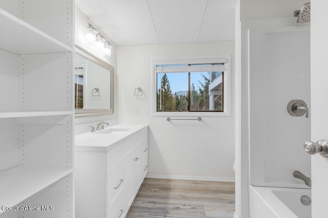 16 Beers Humbird Rd, Sagle, ID 83860 - full bathroom with vanity, wood finished floors, and shower / bathtub combination