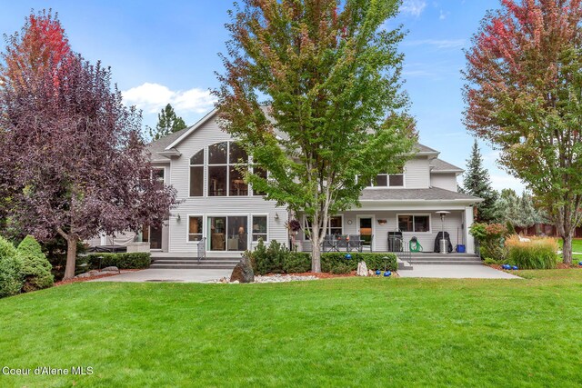 2177 E Totten Ln, Dalton Gardens, ID 83815 - rear view of house featuring a yard and a porch