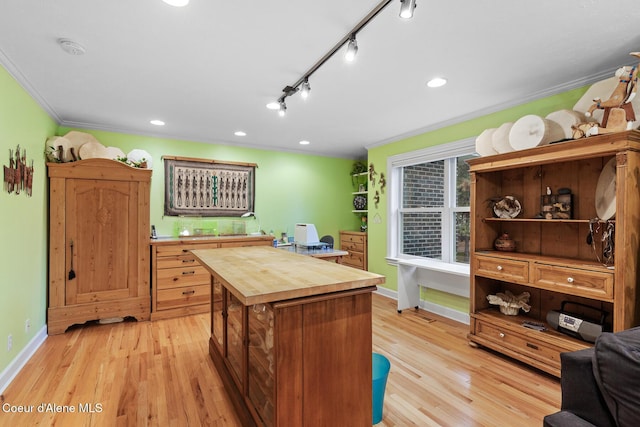 2177 E Totten Ln, Dalton Gardens, ID 83815 - office featuring crown molding, baseboards, light wood-type flooring, recessed lighting, and rail lighting