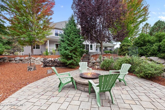 2177 E Totten Ln, Dalton Gardens, ID 83815 - view of patio with an outdoor fire pit