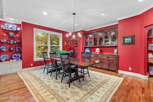 2177 E Totten Ln, Dalton Gardens, ID 83815 - dining space featuring light wood-style floors, recessed lighting, a chandelier, baseboards, and ornamental molding