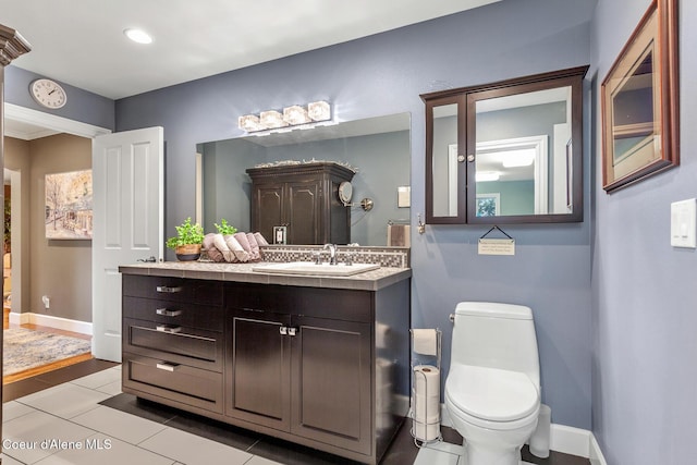 2177 E Totten Ln, Dalton Gardens, ID 83815 - bathroom with vanity, toilet, tile patterned floors, baseboards, and recessed lighting