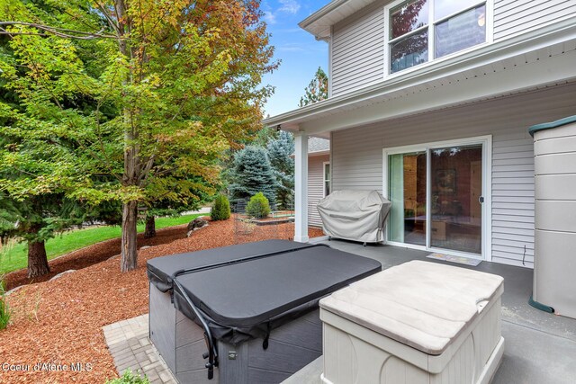 2177 E Totten Ln, Dalton Gardens, ID 83815 - view of patio featuring a grill and a hot tub