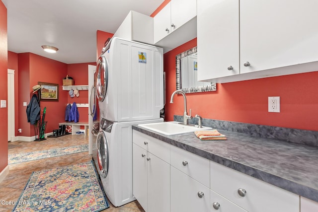 2177 E Totten Ln, Dalton Gardens, ID 83815 - laundry area with stacked washer / dryer, cabinet space, and baseboards