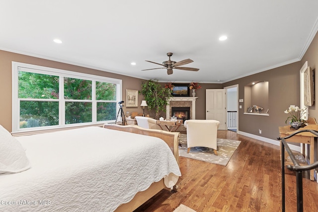 2177 E Totten Ln, Dalton Gardens, ID 83815 - bedroom featuring ornamental molding, a lit fireplace, wood finished floors, baseboards, and recessed lighting