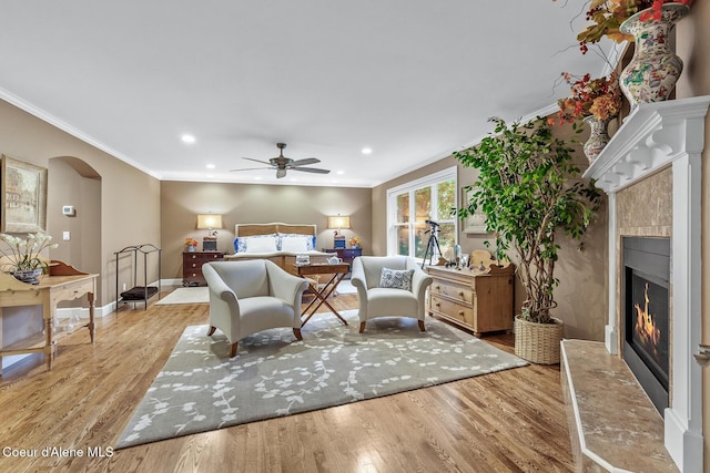2177 E Totten Ln, Dalton Gardens, ID 83815 - bedroom featuring a fireplace, ornamental molding, light wood finished floors, arched walkways, and recessed lighting