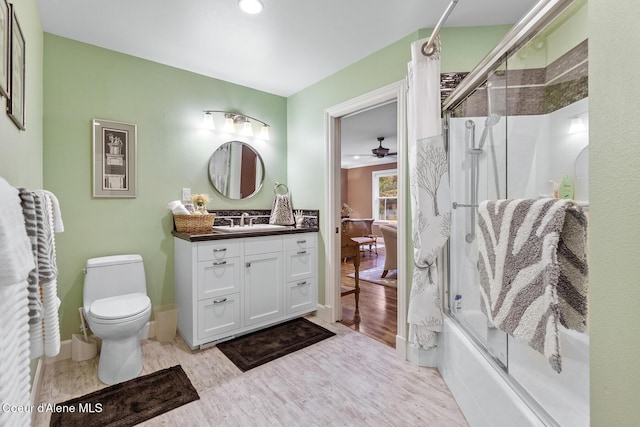 2177 E Totten Ln, Dalton Gardens, ID 83815 - bathroom with vanity, combined bath / shower with glass door, toilet, wood finished floors, and recessed lighting
