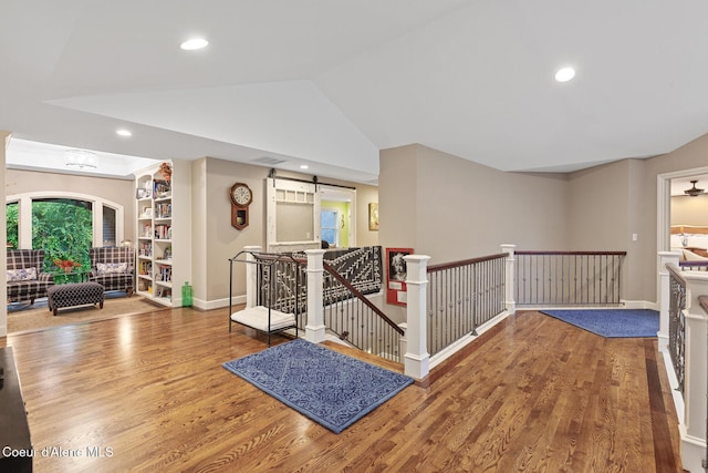 2177 E Totten Ln, Dalton Gardens, ID 83815 - hall with wood finished floors, an upstairs landing, vaulted ceiling, recessed lighting, and baseboards