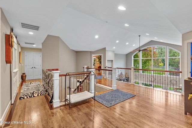 2177 E Totten Ln, Dalton Gardens, ID 83815 - hall with an upstairs landing, wood finished floors, vaulted ceiling, recessed lighting, and baseboards