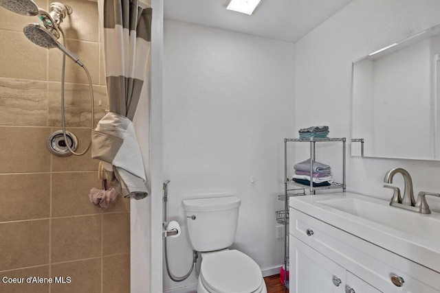 929 Irish Rd, Sagle, ID 83860 - bathroom with vanity, a tile shower, and toilet