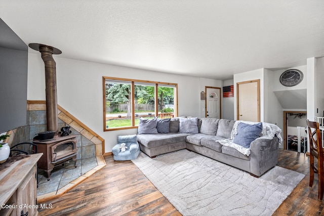 8525 W Nevada St, Rathdrum, ID 83858 - living room with a wood stove and wood finished floors