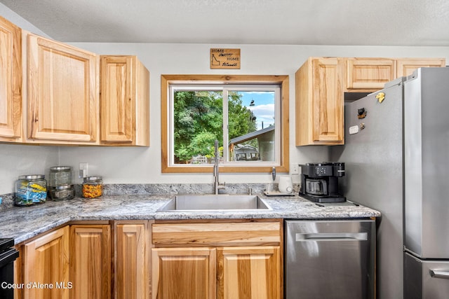 8525 W Nevada St, Rathdrum, ID 83858 - kitchen featuring appliances with stainless steel finishes, a sink, and light brown cabinets