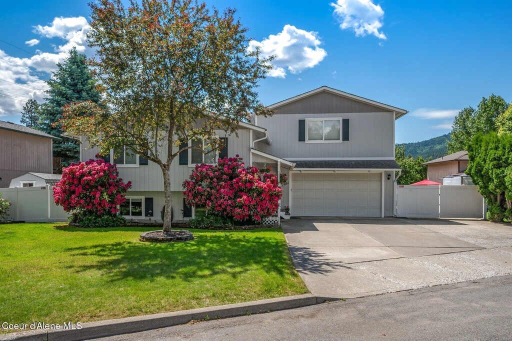 1961 E Sundance Dr, Post Falls, ID 83854 - view of front of property with an attached garage and concrete driveway