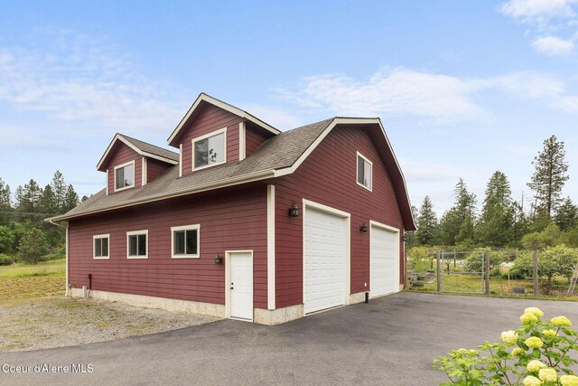 5120 W Foothill Dr, Coeur Dalene, ID 83814 - view of home's exterior with a detached garage